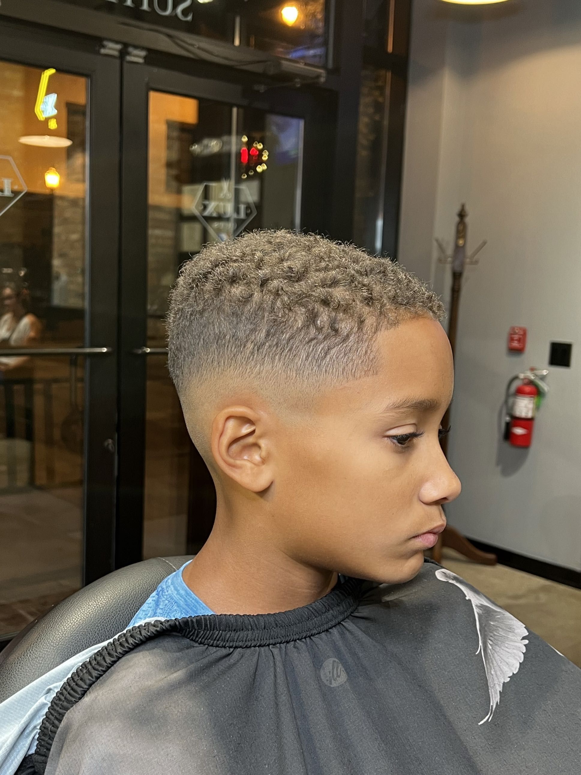 Smiling Lux Cuts client after a fresh cut and beard trim